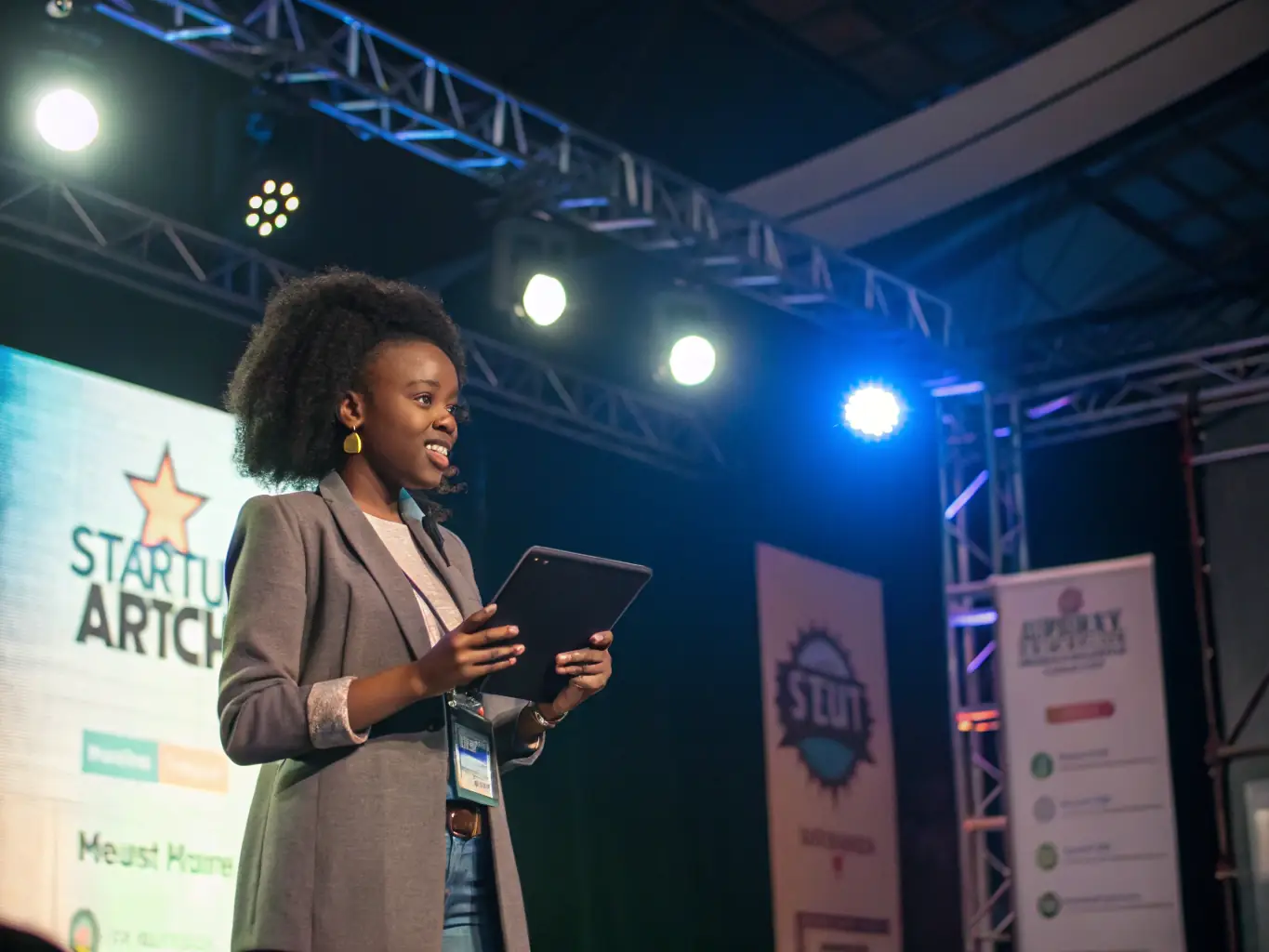An image of a startup founder confidently presenting a business plan to a panel of investors in a modern boardroom setting, emphasizing professionalism and preparation.
