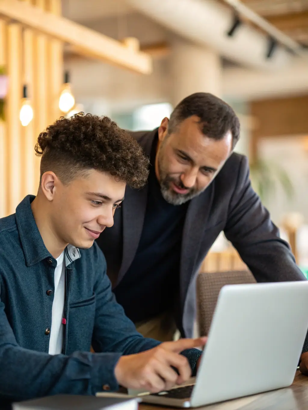 An image of a mentor guiding a startup founder through a business plan, emphasizing Growspark.fun's commitment to personalized mentorship.